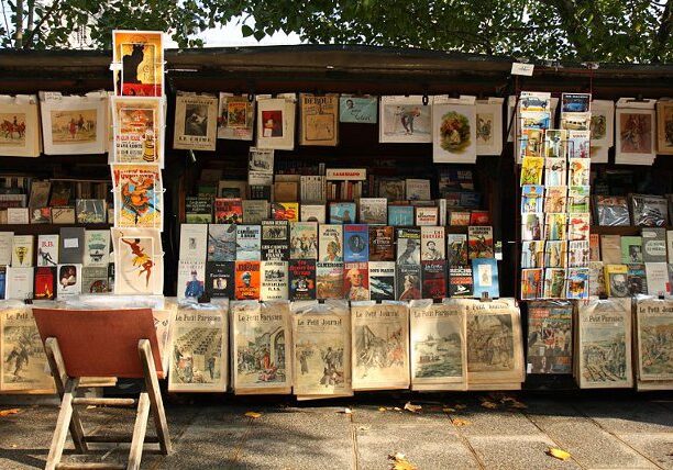 A stand of a bouquiniste (french term for second-hand books resellers) , in Paris, near the Cathedral Notre-Dame of Paris. Bouquinistes can be considered a landmark of Paris. There are nearly 250 of them, mainly located in the central area of the city, alongside the banks of the Seine river.