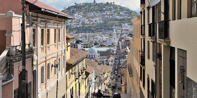 Quito, capital of Ecuador, Garcia Moreno street in the historic center of the city. The Virgin of Quito is seen in the background.