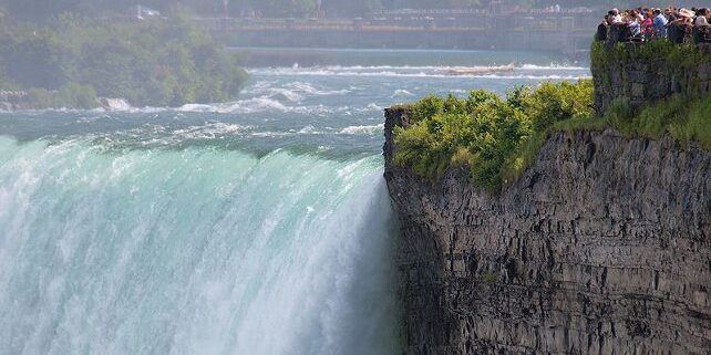 Canadians watching the Horsesehoe Falls. Canadians get better view of American, Bridal as well as Canadian Horseshoe Falls.