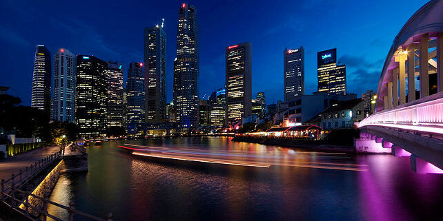 Reflections from the lighted buildings, bridge, river banks and a sightseeing cruise produces a spectacular spectrum of reflected colors.